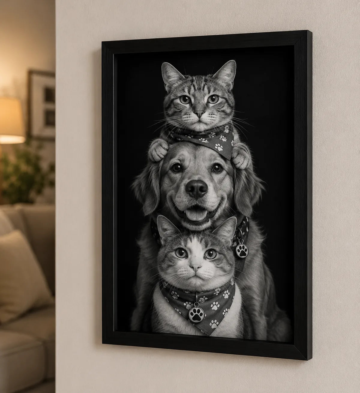Framed black-and-white portrait of a dog between two cats